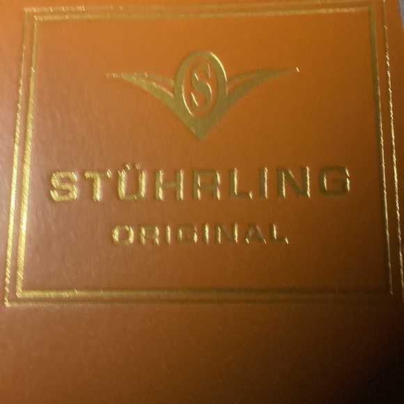 Gorgeous Stuhrling woman’s skeleton watch with several colored bands. - Picture 5 of 9